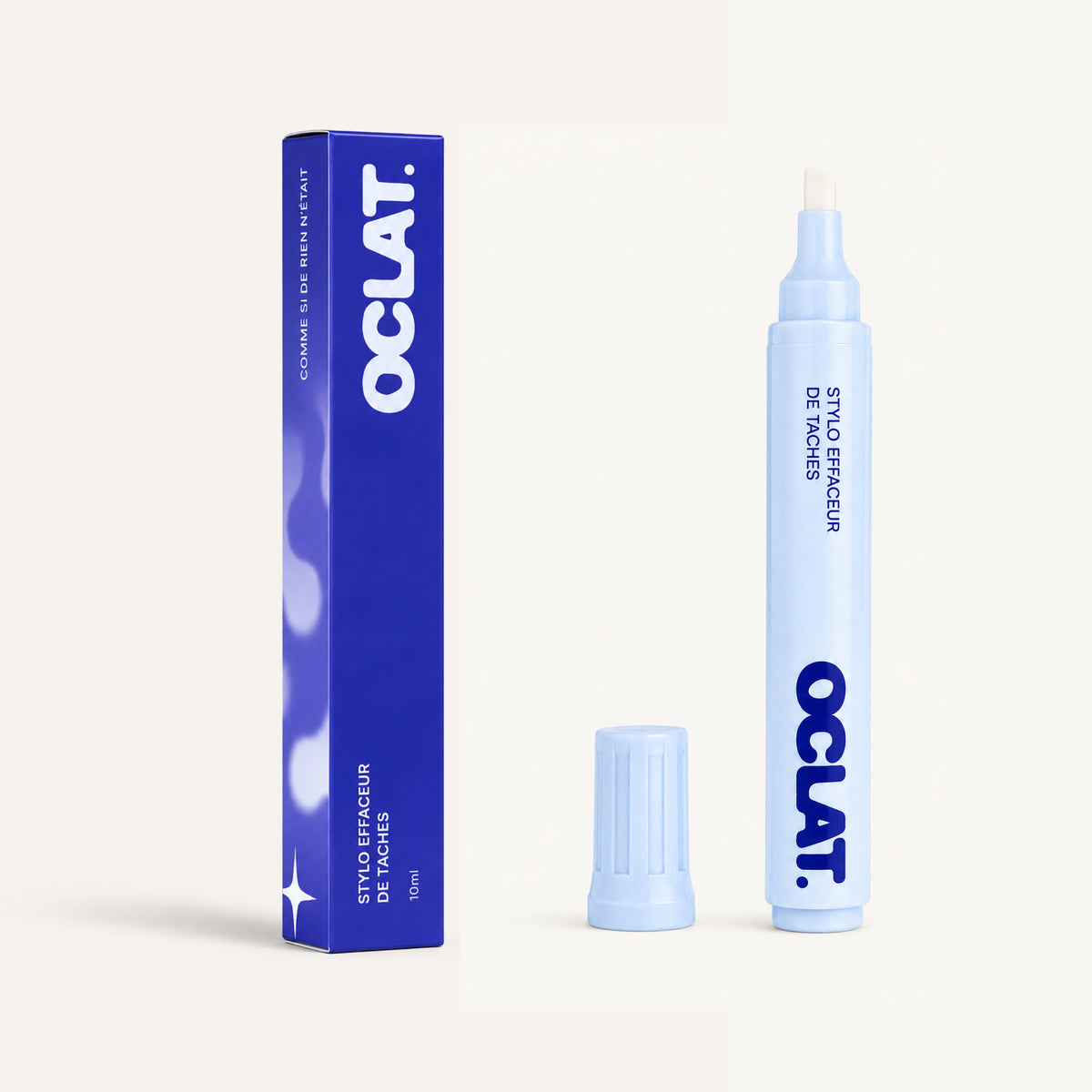 Stylo détachant Oclat avec son emballage, conçu pour enlever les taches fraîches sur les vêtements du quotidien.